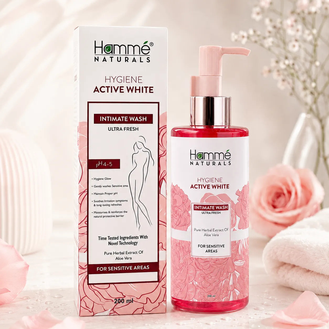 Hemme Naturals Hygiene Active White Intimate Wash bottle and packaging with flowers in the background