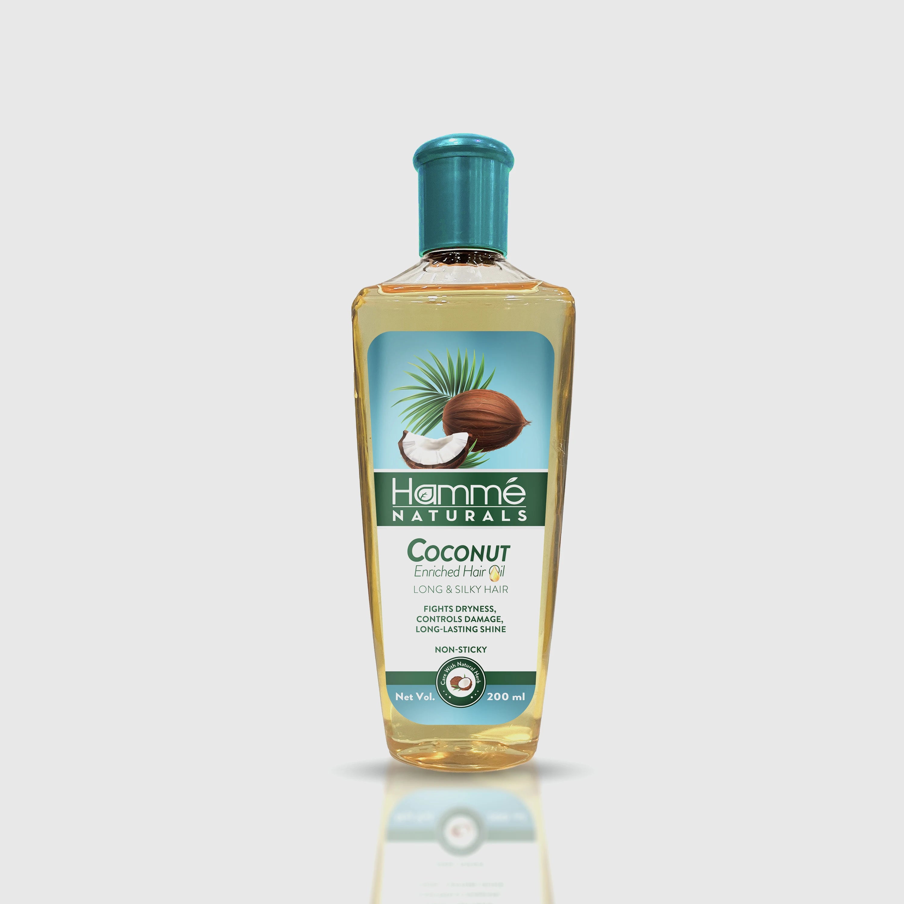 Coconut Enriched Hair Oil - Hammé - Makes You Stand out  -A bottle of coconut oil beside a coconut, highlighting its natural benefits for nourishing hair health