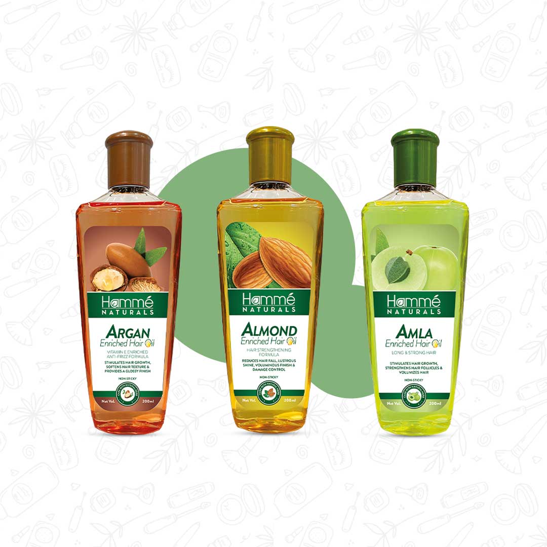 Essential Hair Oils Pack - Hammé - Makes You Stand out  - Hamme Naturals Essential Hair Oils Pack with Argan, Almond, and Amla oils displayed alongside almonds and other natural elements
